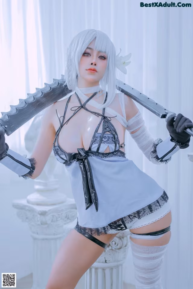 A woman in a white and black outfit holding two swords.