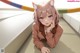 Anime girl with cat ears laying on the floor.