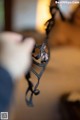 A close up of a person holding a pair of glasses.